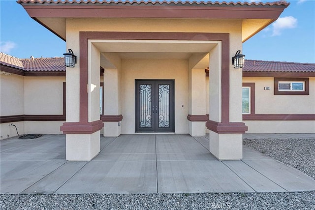 property entrance featuring french doors