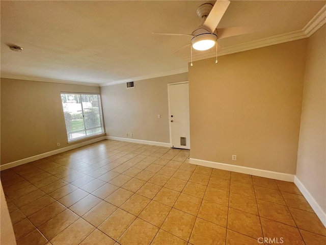 tiled spare room with crown molding and ceiling fan