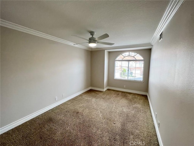 carpeted spare room featuring ceiling fan, ornamental molding, and a textured ceiling