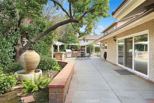 view of patio featuring exterior kitchen and grilling area