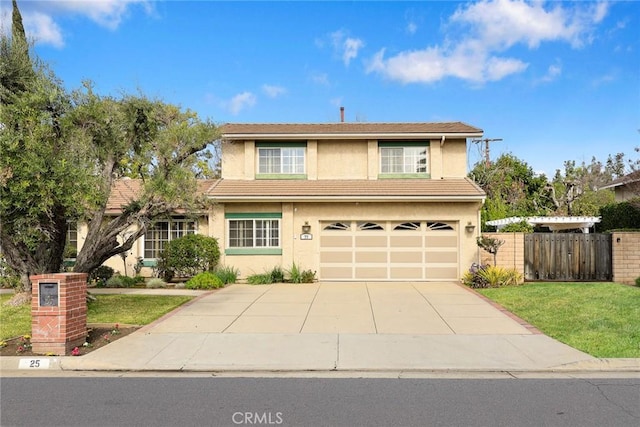 front of property with a garage and a front lawn