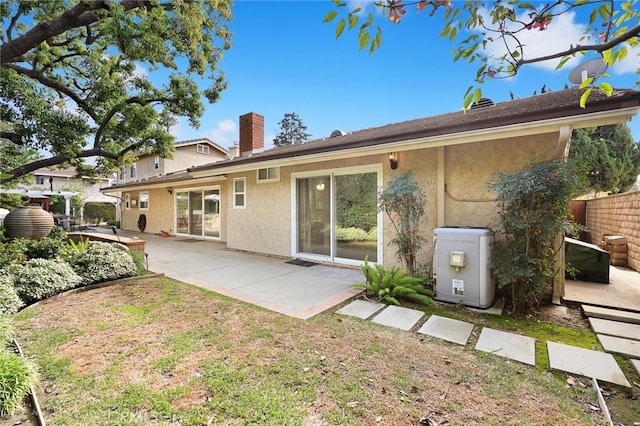 rear view of house featuring a patio area