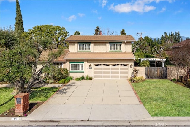 view of property featuring a garage and a front lawn