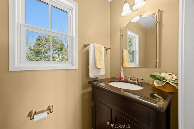 bathroom featuring a healthy amount of sunlight and vanity