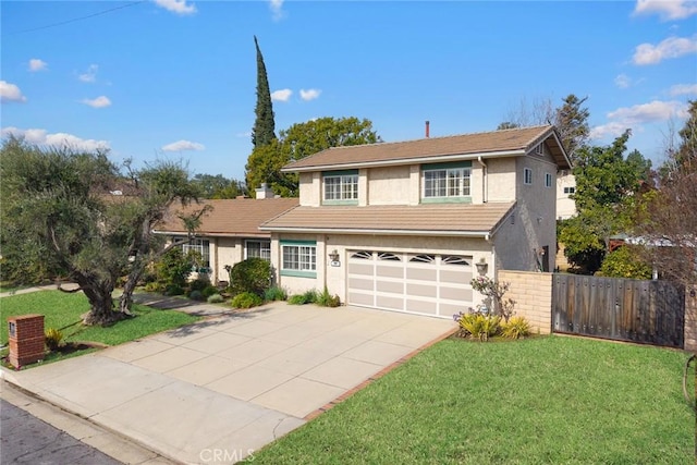 view of front property featuring a garage and a front yard