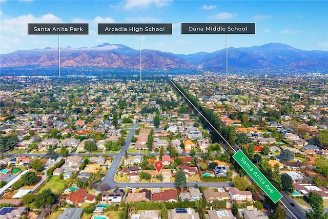 birds eye view of property with a mountain view