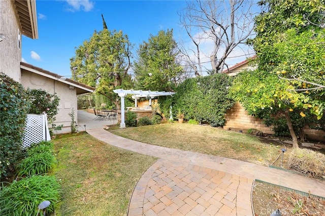 view of yard with a pergola and a patio