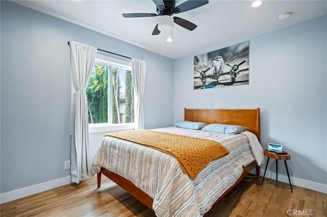 bedroom featuring ceiling fan and hardwood / wood-style floors