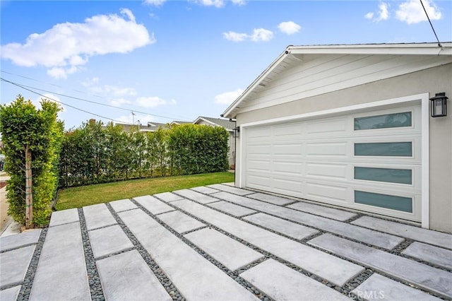 garage with a lawn