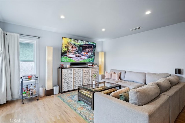 living room with light hardwood / wood-style flooring