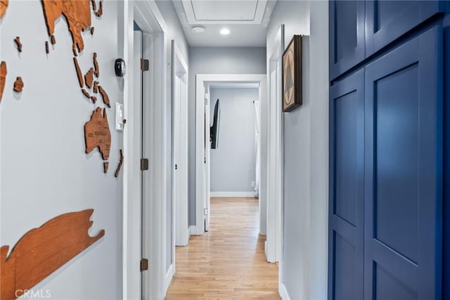 corridor with light wood-type flooring