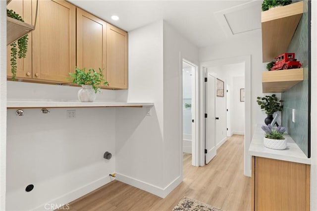 washroom with light hardwood / wood-style flooring