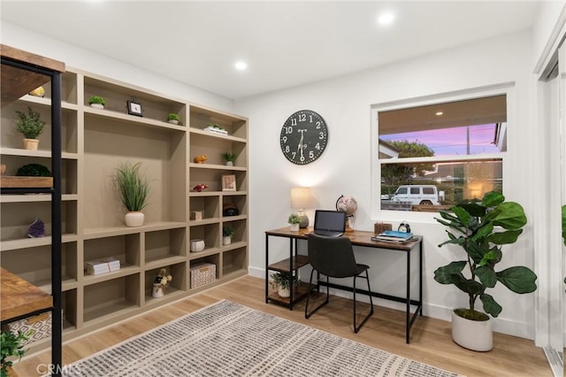 office area with hardwood / wood-style floors