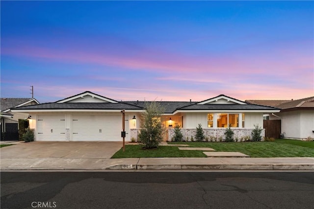 ranch-style home featuring a garage