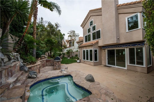 rear view of property with a patio area