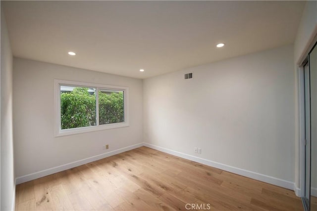 unfurnished room featuring light wood-type flooring