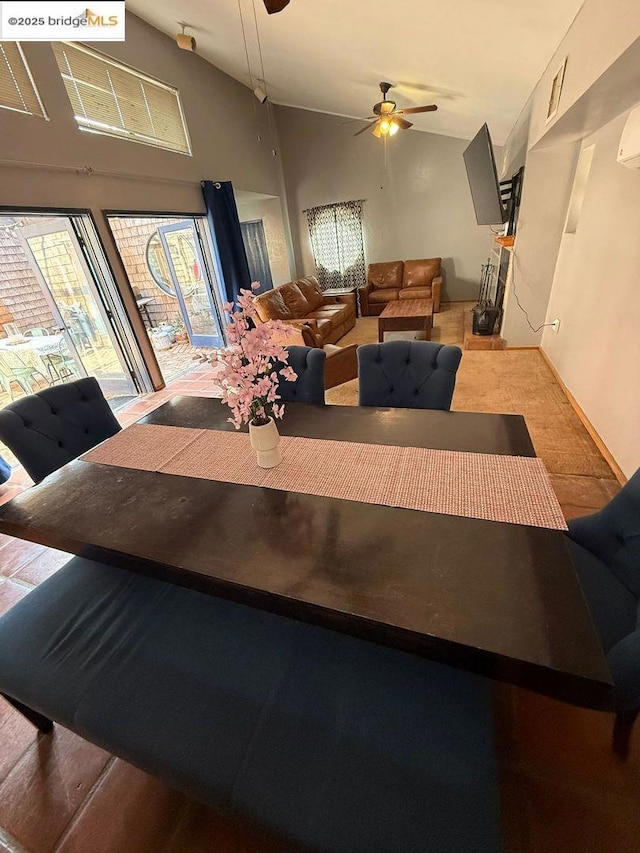 dining area featuring high vaulted ceiling and ceiling fan