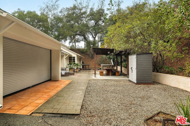 view of yard featuring a pergola and a patio area