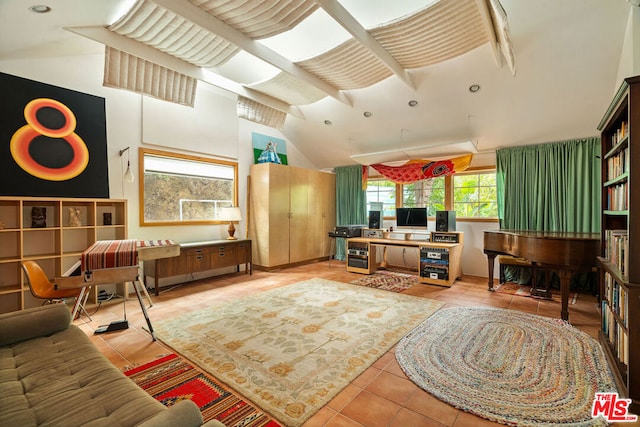 living room with vaulted ceiling and light tile patterned floors