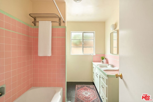 bathroom featuring vanity and tiled shower / bath combo