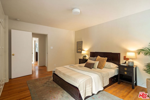 bedroom featuring hardwood / wood-style flooring