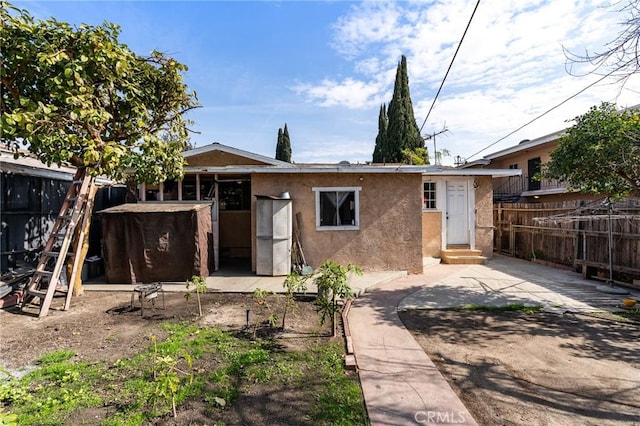 rear view of house with a patio area