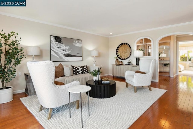 living room featuring hardwood / wood-style floors and ornamental molding