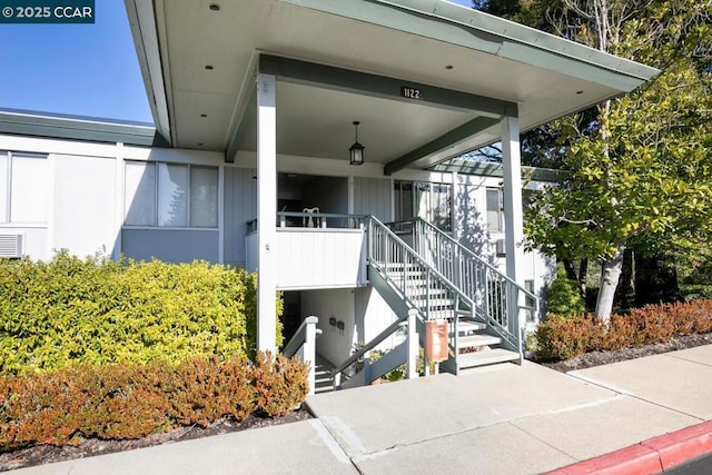 view of exterior entry with a porch