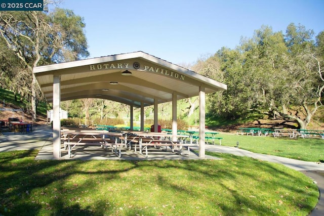 surrounding community with a gazebo and a yard