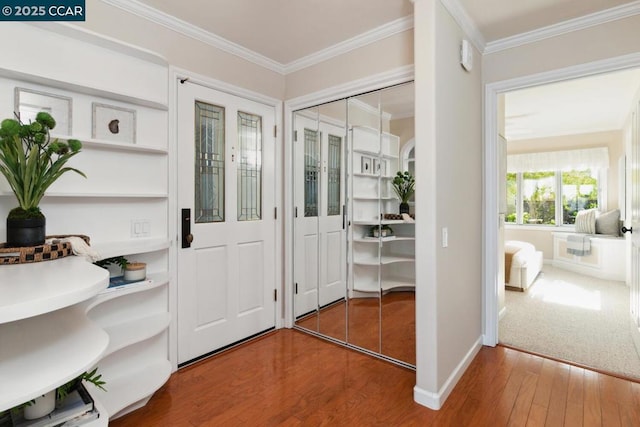 doorway to outside featuring ornamental molding and hardwood / wood-style floors