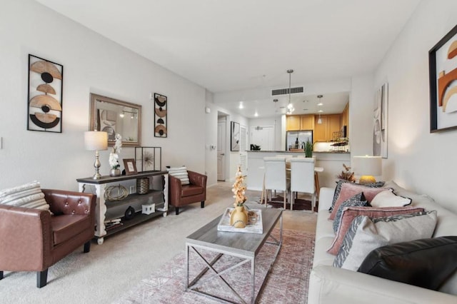 living room featuring light carpet