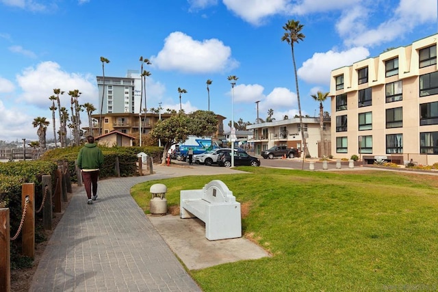 view of property's community with a yard