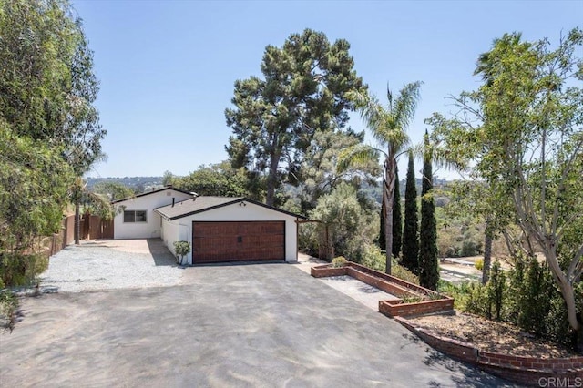 view of side of home featuring a garage