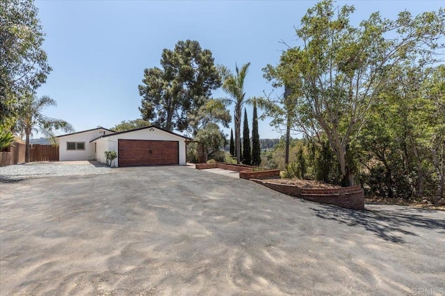 view of side of home with a garage