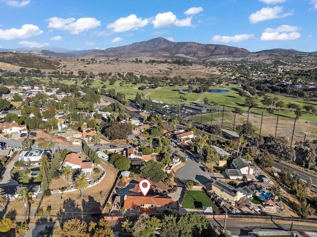 drone / aerial view with a residential view and a mountain view