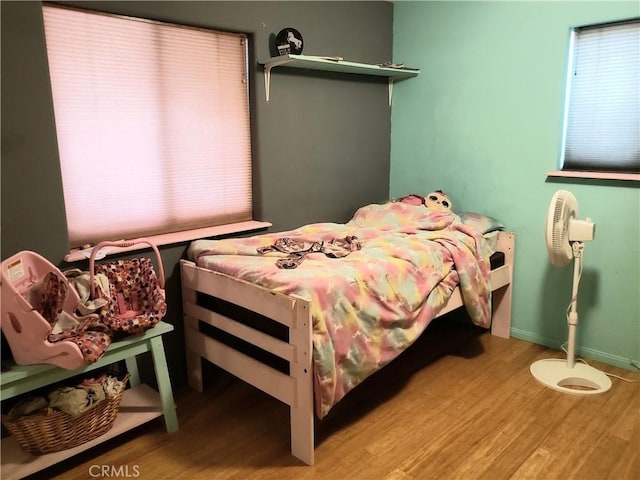 bedroom featuring hardwood / wood-style floors