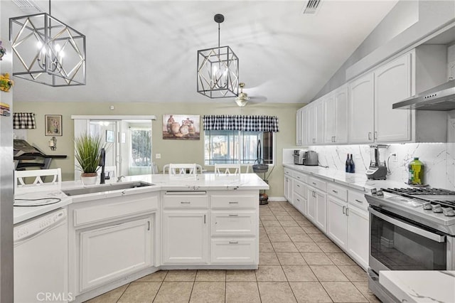 kitchen featuring white dishwasher, decorative light fixtures, stainless steel gas range, and white cabinets