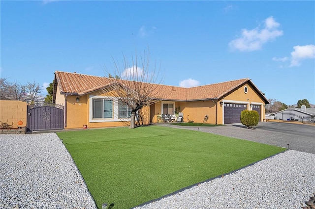 ranch-style house with a garage and a front yard