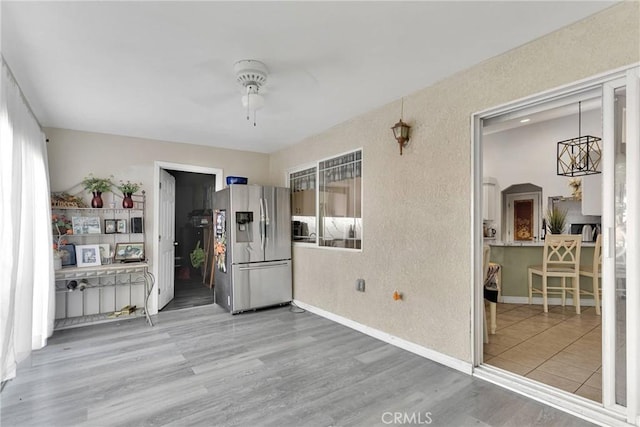 interior space with hardwood / wood-style flooring and ceiling fan