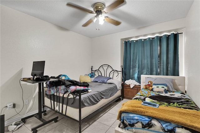 bedroom with light tile patterned floors and ceiling fan