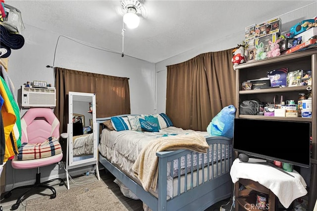 bedroom featuring a wall mounted AC