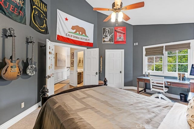 carpeted bedroom featuring high vaulted ceiling and ceiling fan