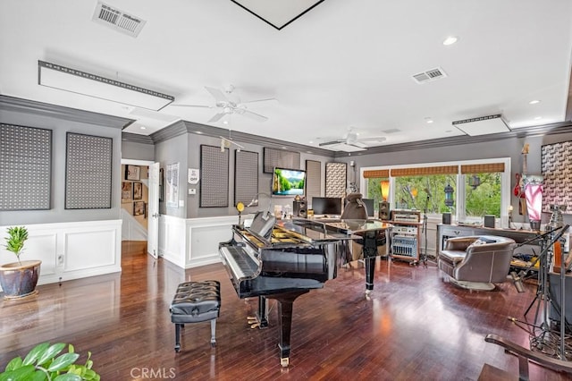 misc room featuring crown molding, wood-type flooring, and ceiling fan