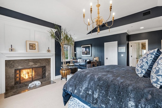 bedroom featuring ornamental molding, a fireplace, a chandelier, and carpet floors