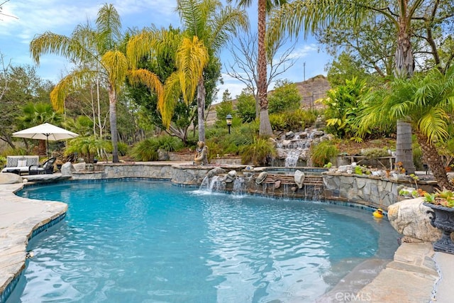 view of swimming pool featuring pool water feature