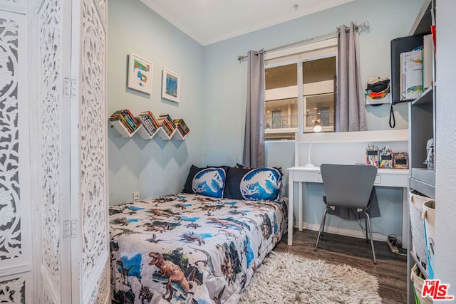 bedroom with hardwood / wood-style flooring and ornamental molding