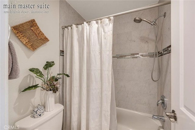 bathroom with shower / bath combination with curtain and toilet