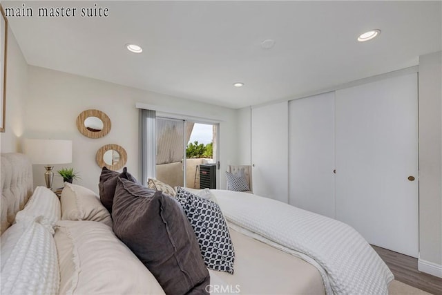 bedroom featuring hardwood / wood-style floors and access to exterior