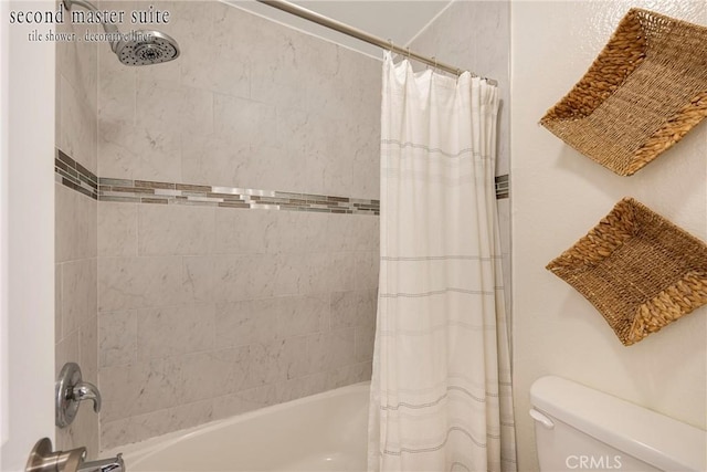 bathroom featuring toilet and shower / bath combo