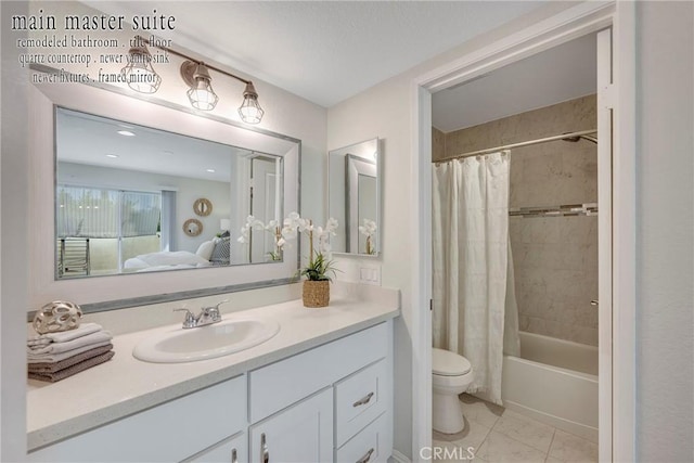 full bathroom with vanity, shower / bath combo with shower curtain, and toilet